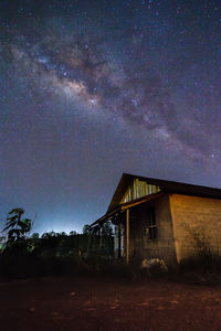 Built structure against star field at night