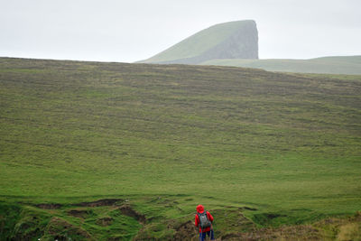 Rear view of man hiking on mountain