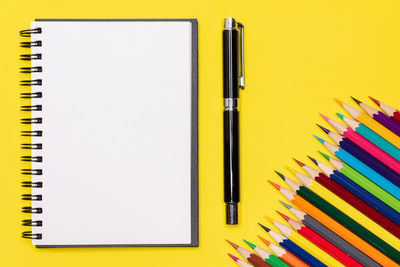 High angle view of multi colored pencils on table