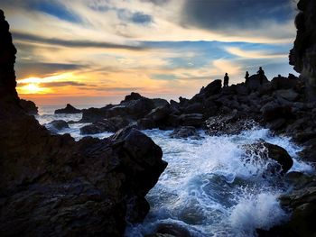 Scenic view of sea at sunset