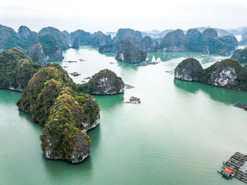 High angle view of rocks in sea against sky