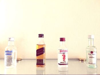 Close-up of bottles against white background