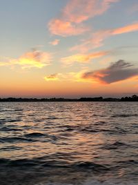 Scenic view of sea against sky at sunset