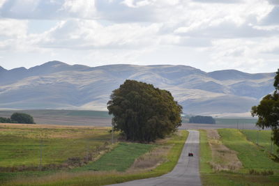 Scenic view of landscape and mountains against sky