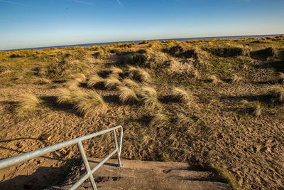 Scenic view of land against clear sky