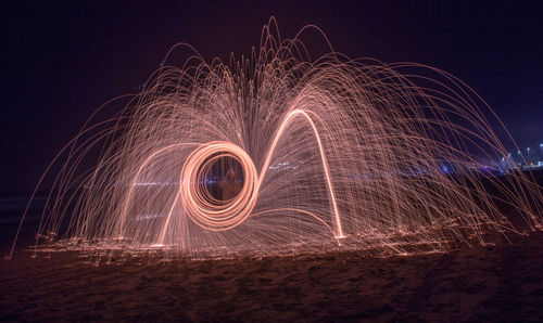 Wire wool at beach during sunset