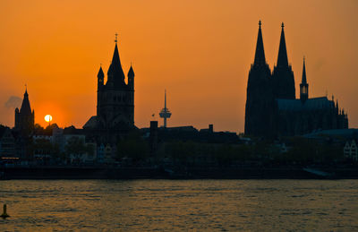 View of temple building against sky during sunset