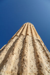 Low angle view of castle against clear blue sky