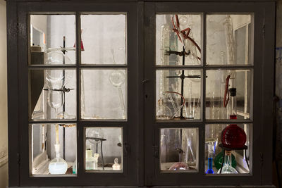 A closed cabinet full of test tubes and other instruments made of glass at tallinn, estonia.