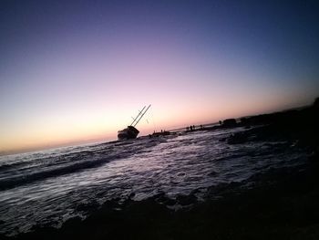 Scenic view of sea against sky at sunset