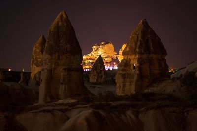 Low angle view of illuminated temple against sky at night