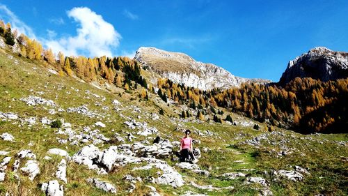 Scenic view of rocks and mountains against sky