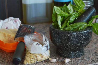 Preparing pesto in traditional mortar