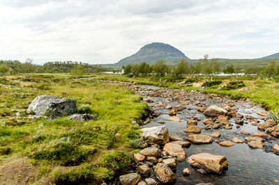 Scenic view of land against sky