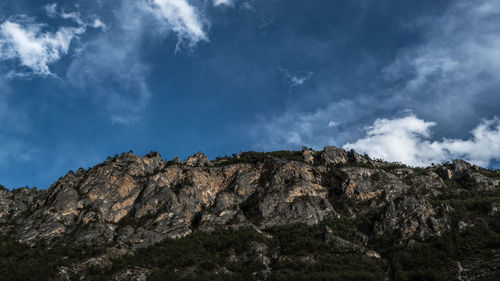 Low angle view of rock formations against sky