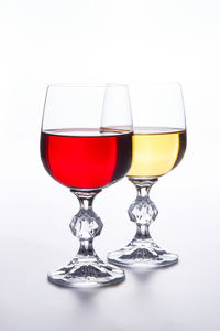 Close-up of wineglass against white background
