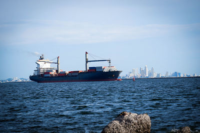 Ship in sea against sky