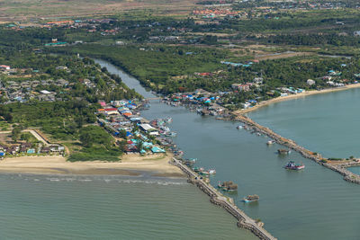 High angle view of boats in river by trees