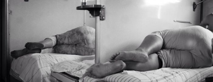 Woman sitting on bed