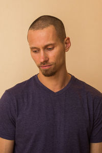 Portrait of man against wall