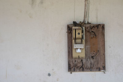 Old telephone booth on wall