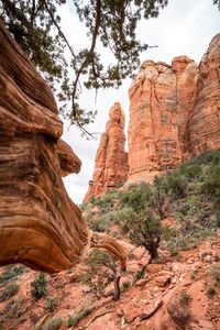 Low angle view of rock formations against sky