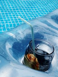 High angle view of drink in swimming pool