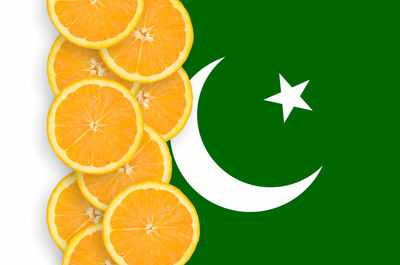 Orange fruit against white background