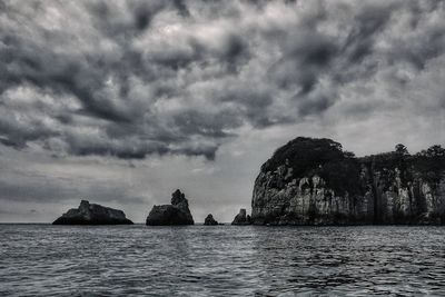 Scenic view of sea against dramatic sky