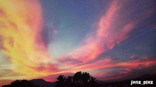 sunset, sky, silhouette, scenics, beauty in nature, cloud - sky, tranquility, orange color, tree, tranquil scene, dramatic sky, nature, low angle view, idyllic, cloud, cloudy, dusk, moody sky, weather, outdoors