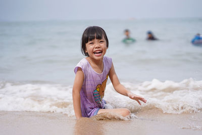 Portrait of happy girl on beach