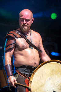 Midsection of man playing at music concert