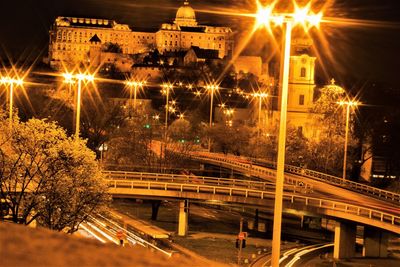 Illuminated bridge at night