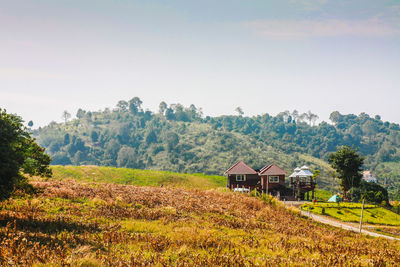 House on field against sky