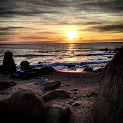 Scenic view of sea at sunset