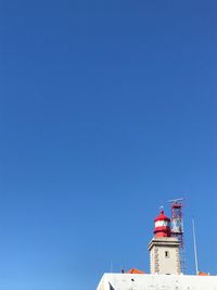 Low angle view of building against clear blue sky