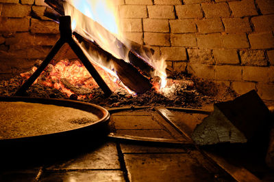 View of burning candles on wood