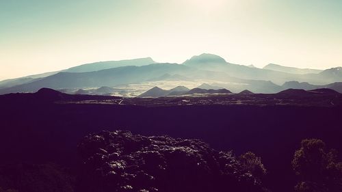 Aerial view of mountains against clear sky