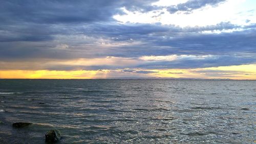 Scenic view of sea against cloudy sky