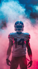 Low angle view of man standing against sky