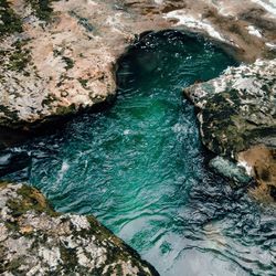 High angle view of rock formation in sea