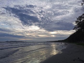 Scenic view of beach against sky during sunset