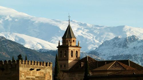 Scenic view of historic church against mountains