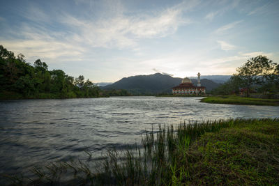 Beautiful view of darul quran mosque with reflections during sunrise in selangor, malaysia.