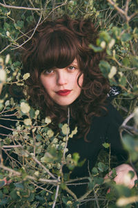 High angle portrait of woman amidst plants