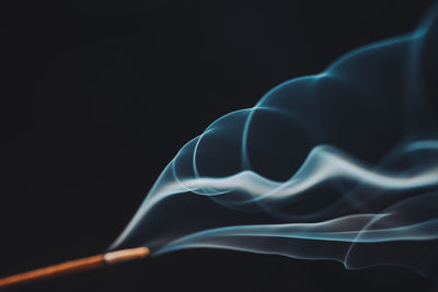 Close-up of smoke against black background