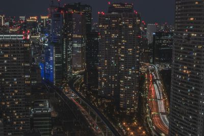 High angle view of illuminated buildings in city