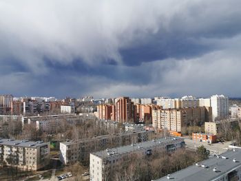 High angle view of buildings in city against sky