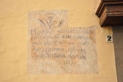 Close-up of text on wall