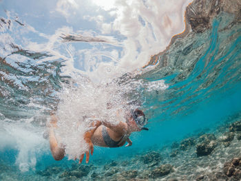 Man swimming in sea